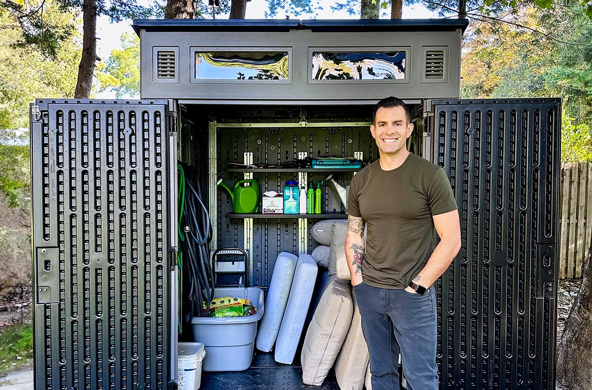 John Colaneri standing in front of an open Suncast shed